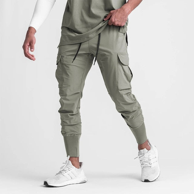 Jogger-Men-s-Sport-Pants-Street-Wear-Elastic-Fashion-Casual-Men-Sweatpants-with-Pockets-Gym-Running.jpg_640x640_494a30bb-508b-4d5f-912f-17daf00c86eb.jpg